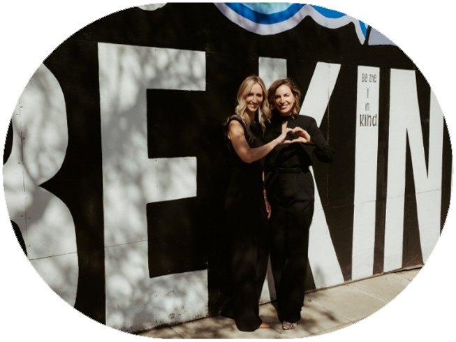 Doctor Stacy and Doctor Jessia holding sign that reads Better Together